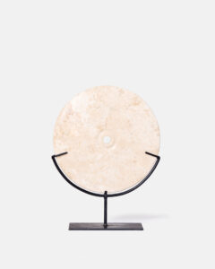 White marble discs on a base