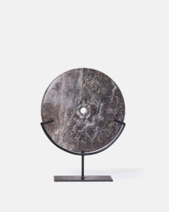 Black marble discs on a metal base